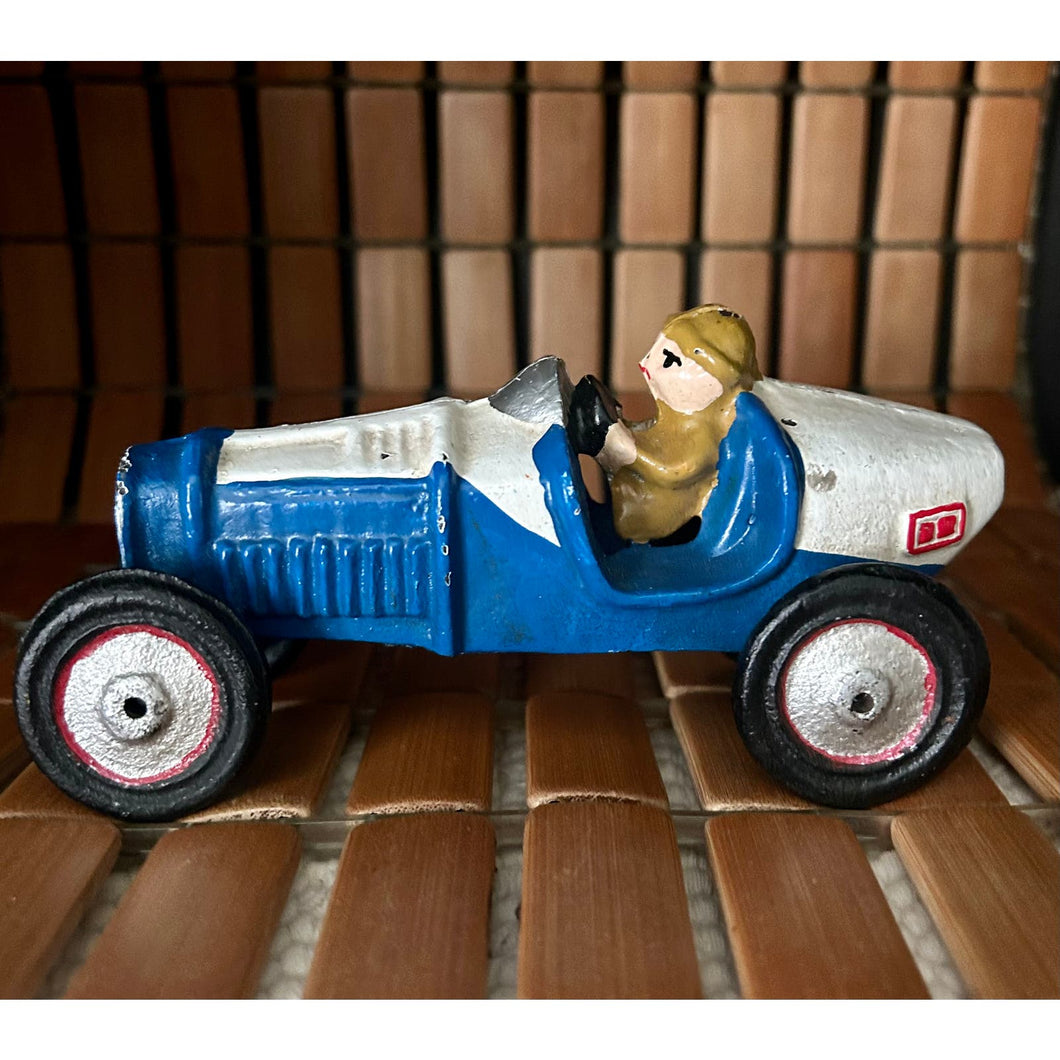 Vintage cast iron toy race car metal painted blue and white with driver