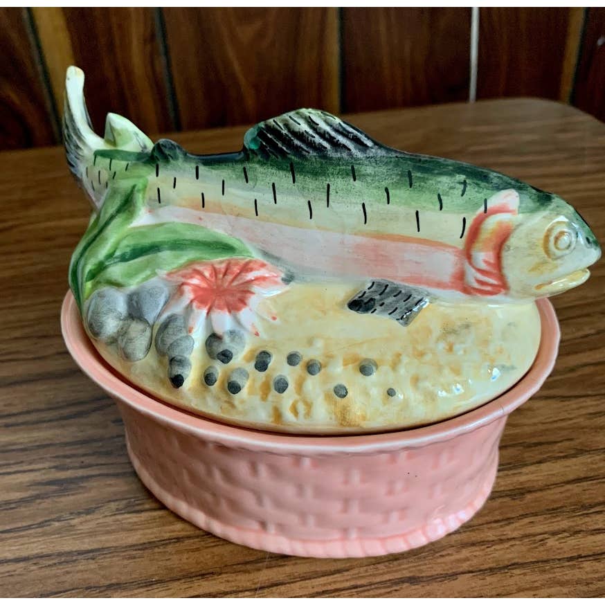 Vintage ceramic salmon tureen with a small chip on the fin and a shallow crack on the inside 